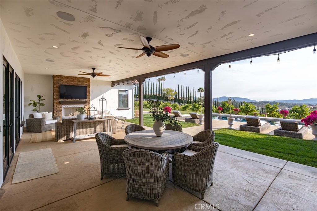 33240 La Serena Way Temecula, CA 92591 - Photo 48 of 75 a dining room with furniture and a floor to ceiling window