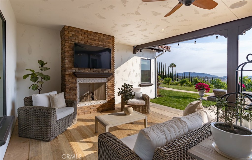 33240 La Serena Way Temecula, CA 92591 - Photo 49 of 75 a living room with furniture fireplace and garden