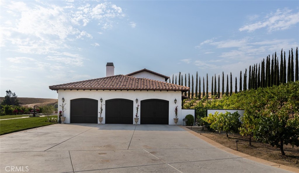 33240 La Serena Way Temecula, CA 92591 - Photo 56 of 75 a front view of a house with a garden