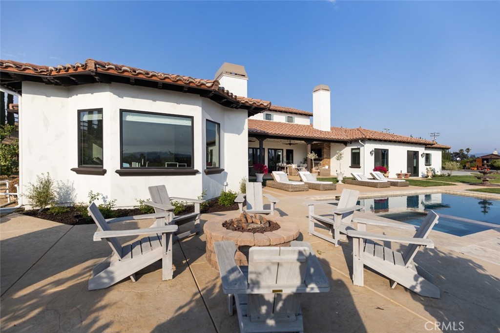 33240 La Serena Way Temecula, CA 92591 - Photo 62 of 75 a view of a patio with couches table and chairs with potted plants