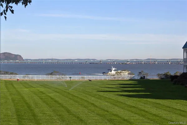 a view of a swimming pool and a yard