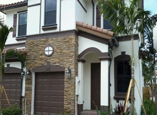 a view of a house with a tree
