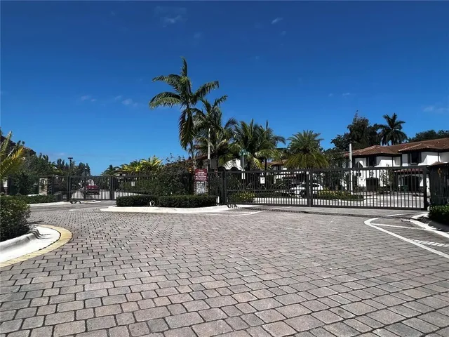 a view of a swimming pool and a yard