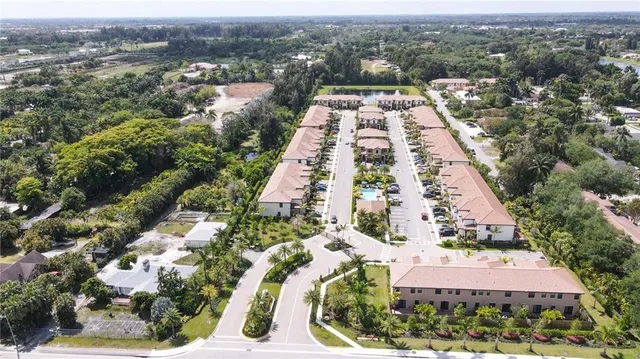 an aerial view of house with yard