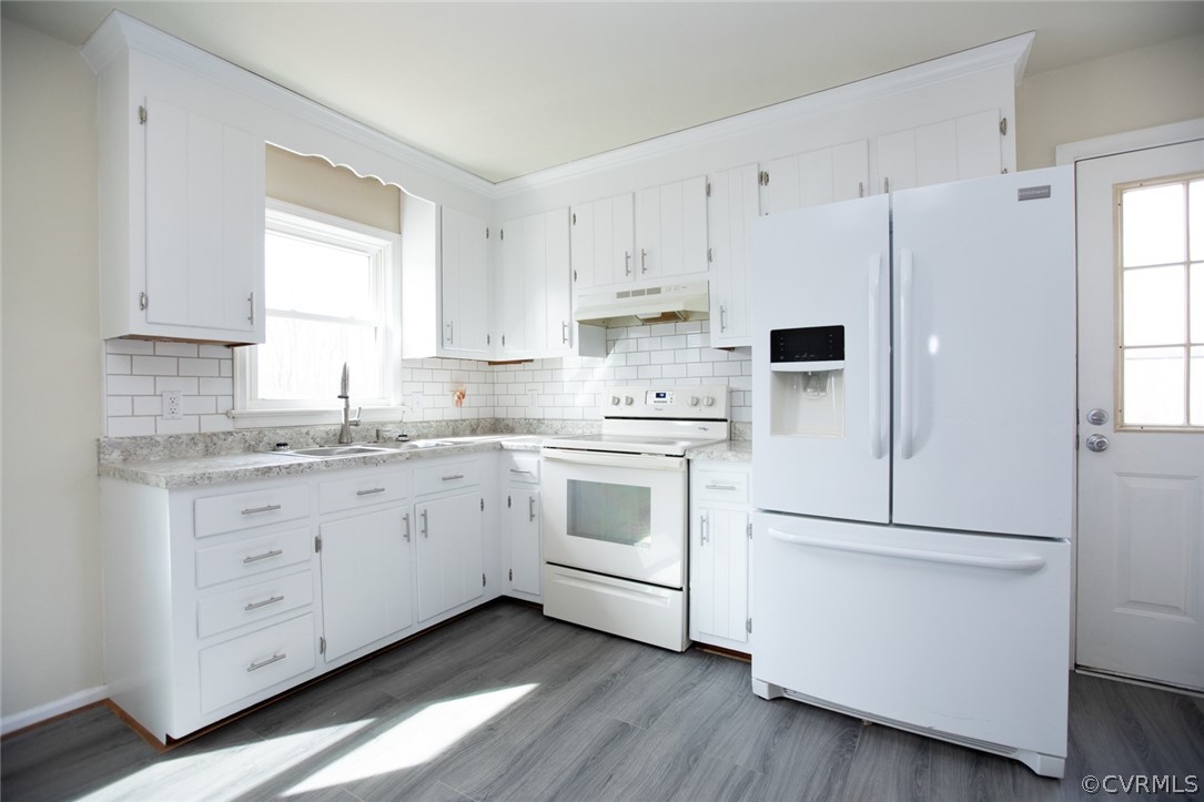 37 Criss Road Cumberland, VA 23040 - Photo 11 of 40 a kitchen with granite countertop white cabinets and white appliances
