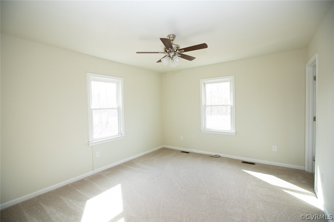 37 Criss Road Cumberland, VA 23040 - Photo 18 of 40 an empty room with a window and a fan