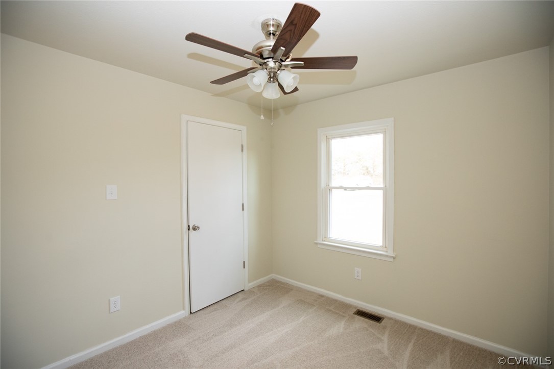 37 Criss Road Cumberland, VA 23040 - Photo 26 of 40 an empty room with a window and a fan