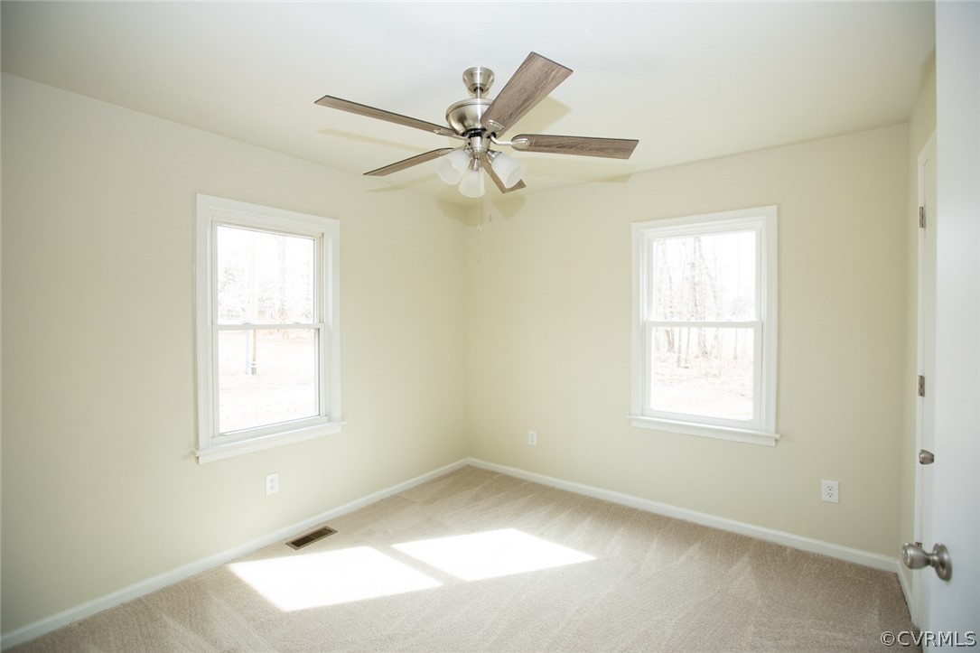 37 Criss Road Cumberland, VA 23040 - Photo 29 of 40 an empty room with a window and a fan