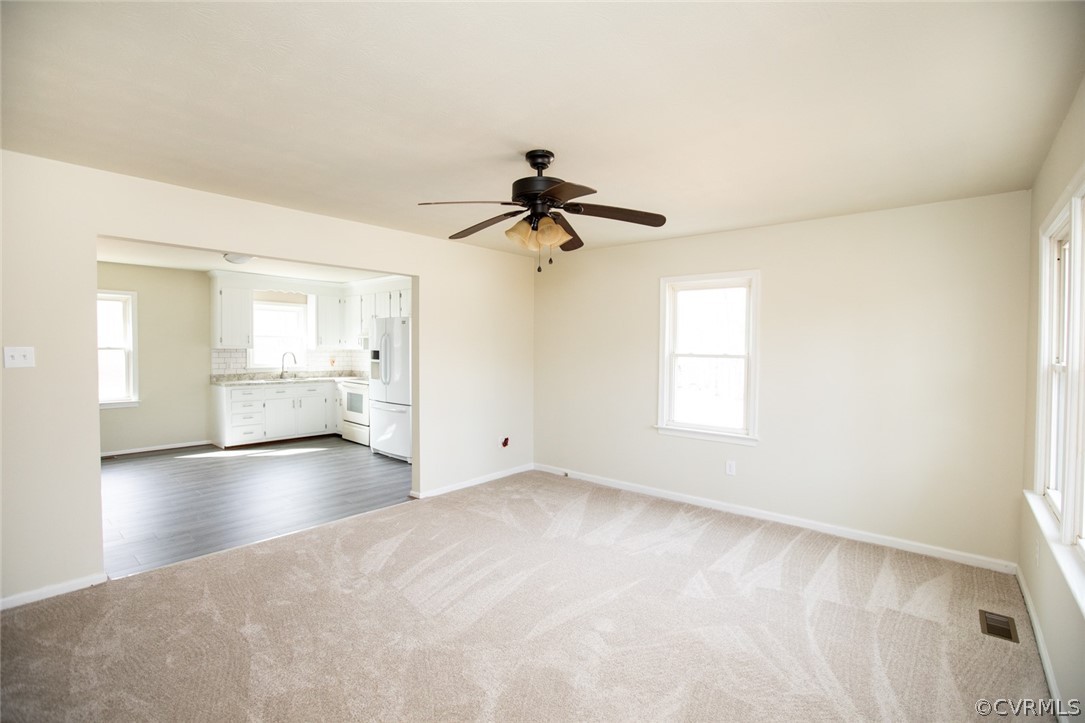 37 Criss Road Cumberland, VA 23040 - Photo 3 of 40 a view of empty room with wooden floor and ceiling fan