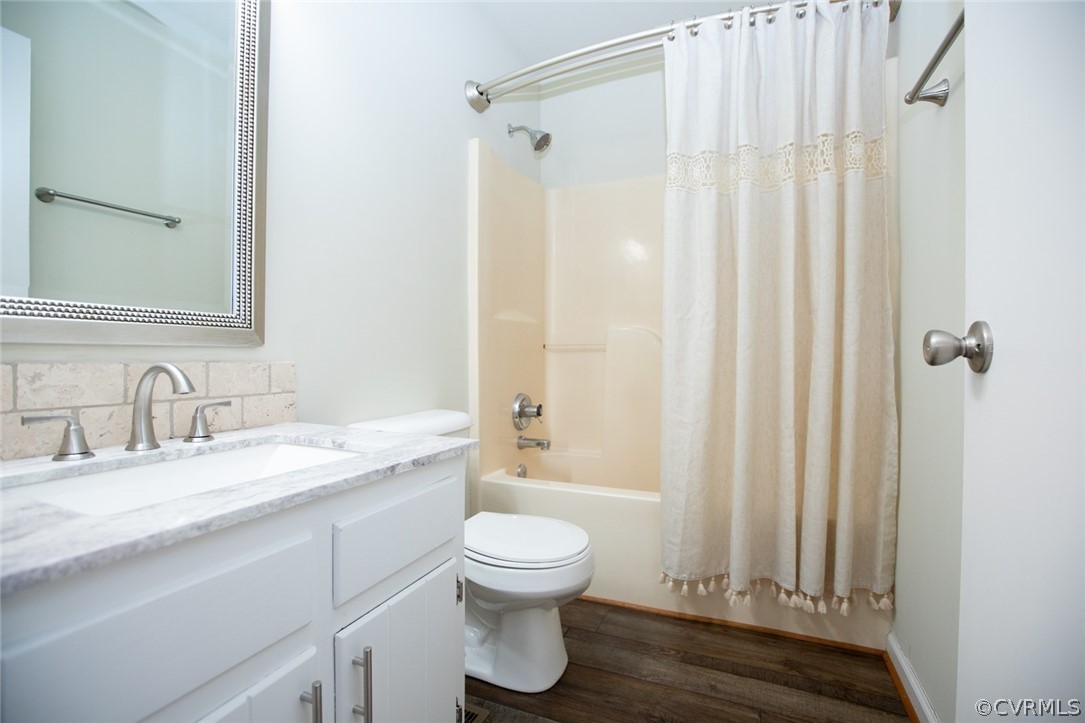 37 Criss Road Cumberland, VA 23040 - Photo 31 of 40 a bathroom with a granite countertop sink toilet a mirror and shower