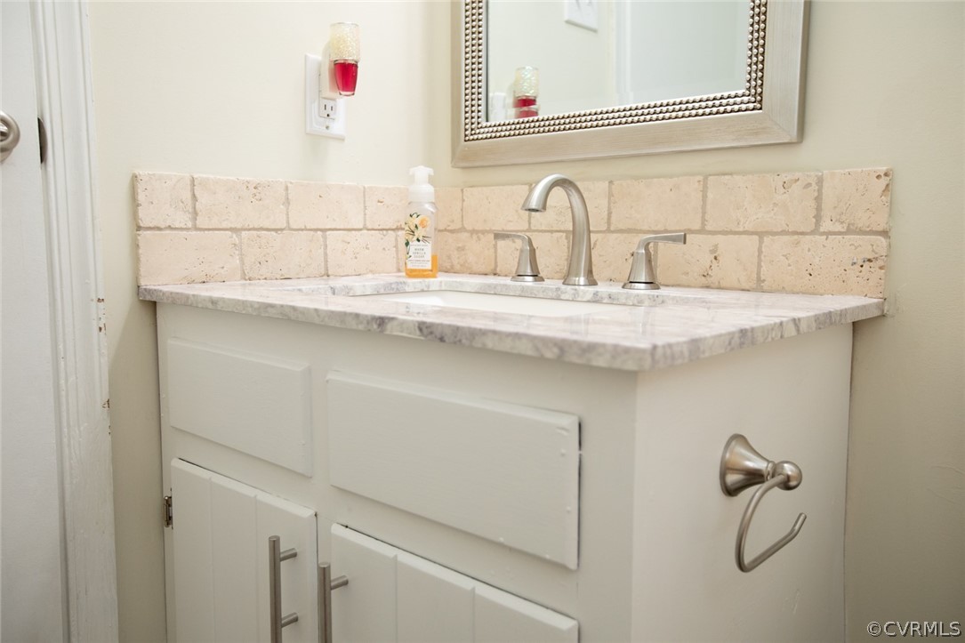 37 Criss Road Cumberland, VA 23040 - Photo 32 of 40 a bathroom with a sink and a mirror