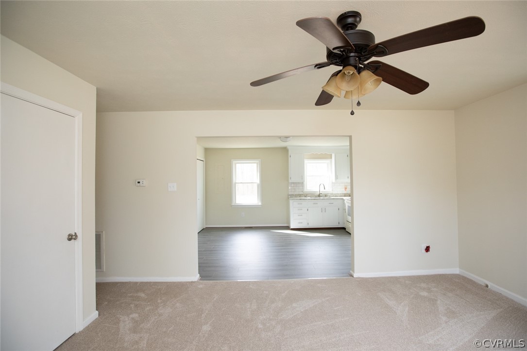 37 Criss Road Cumberland, VA 23040 - Photo 4 of 40 an empty room with a ceiling fan and a window