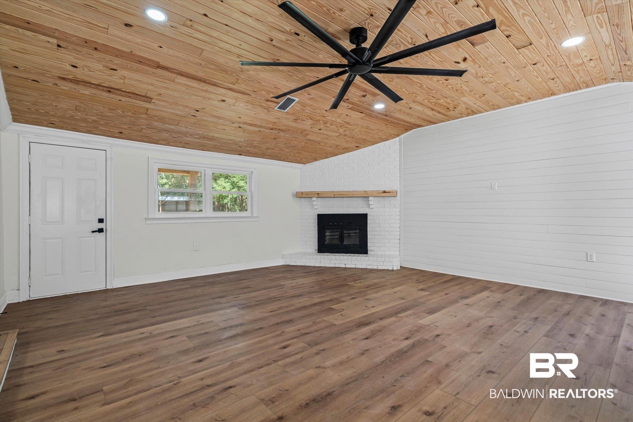 4156 Furman Drive Mobile, AL 36619 - Photo 2 of 24 Unfurnished living room with wood finished floors, ceiling fan, a fireplace, wooden ceiling, and vaulted ceiling