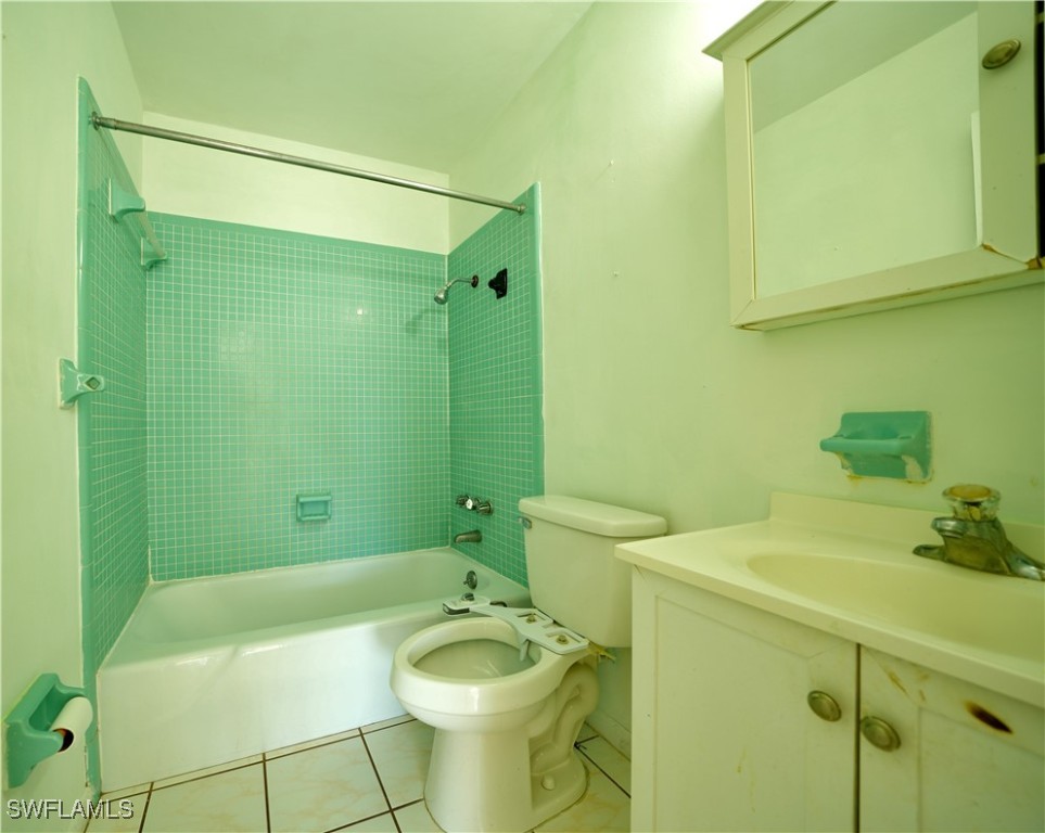 720 Joel Boulevard Lehigh Acres, FL 33936 - Photo 1 of 9 a bathroom with a sink toilet and tub
