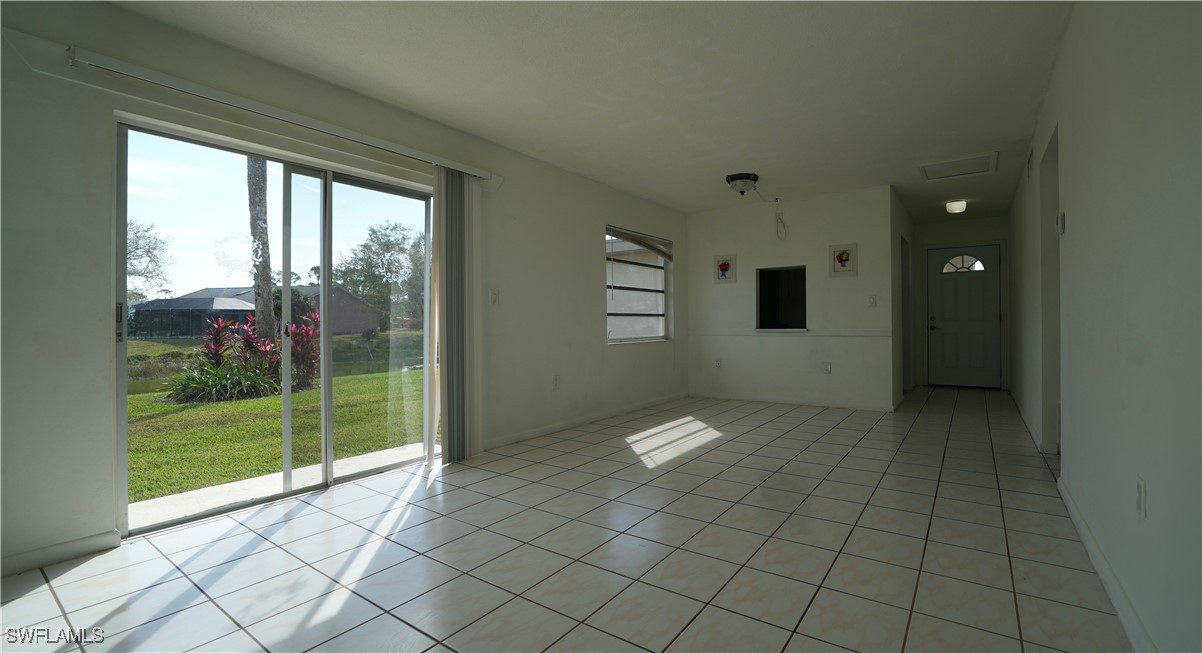 720 Joel Boulevard Lehigh Acres, FL 33936 - Photo 2 of 9 a view of an empty room and window