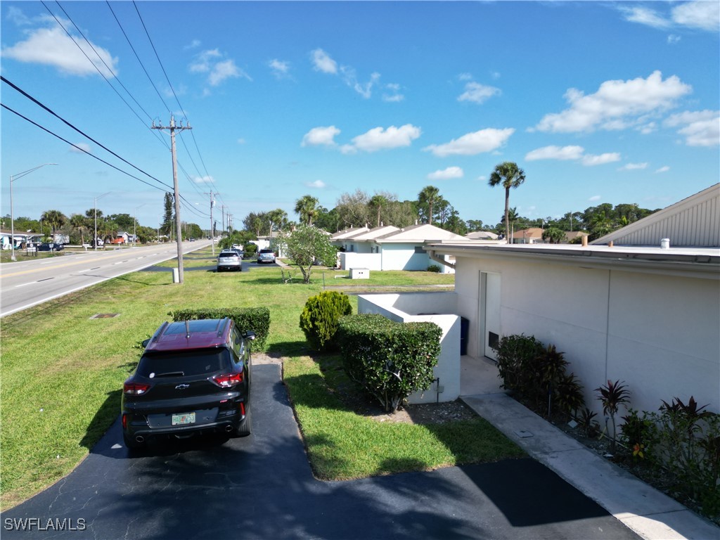 720 Joel Boulevard Lehigh Acres, FL 33936 - Photo 6 of 9 a yard with lots of green space