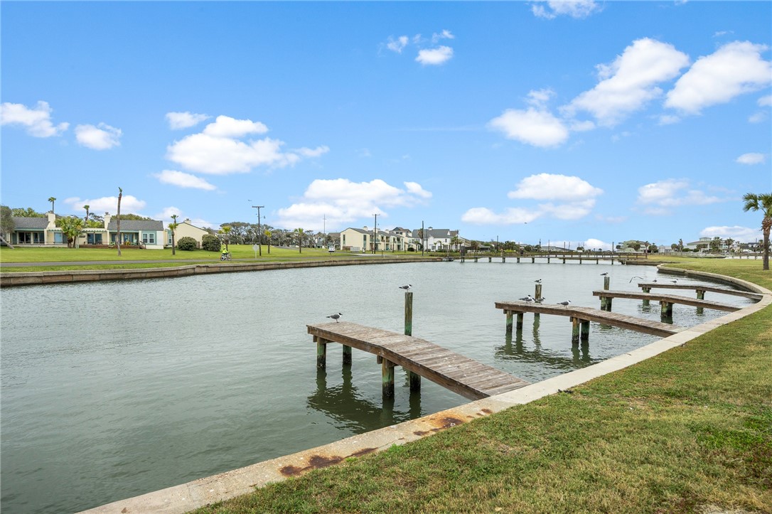 2003 North Fulton Beach Road, Unit 34 34 Rockport, TX 78382 - Photo 34 of 38 a view of a lake with a big yard