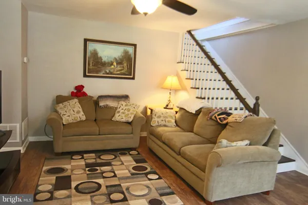 a living room with furniture and a rug