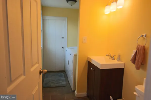 a bathroom with a sink and mirror