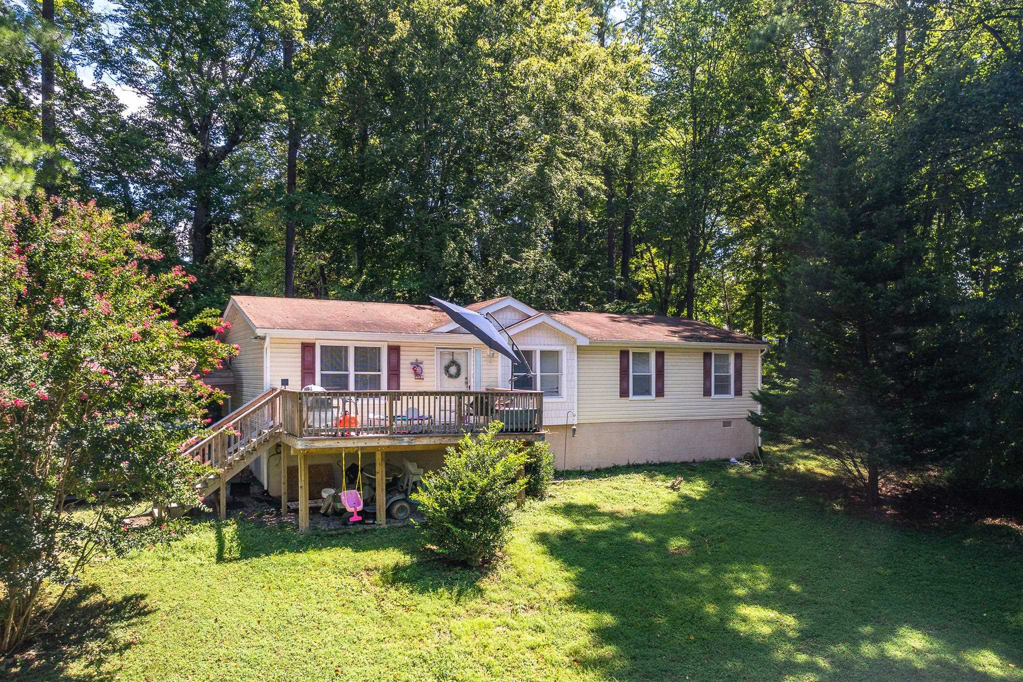 140 Garford Road Madison Heights, VA 24572 - Photo 1 of 35 a view of a house with a big yard plants and large trees