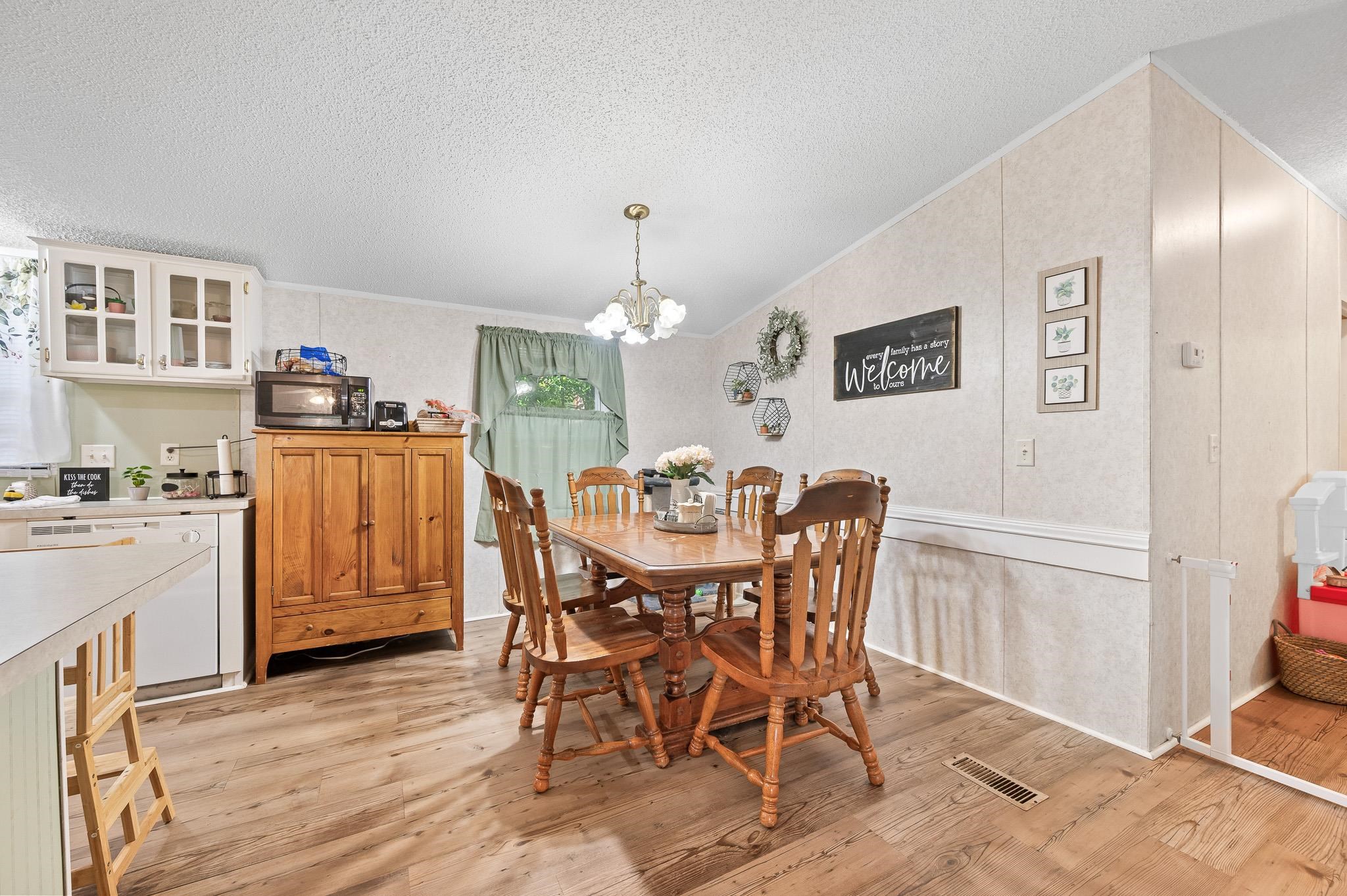 140 Garford Road Madison Heights, VA 24572 - Photo 11 of 35 a view of a dining room with furniture and chandelier
