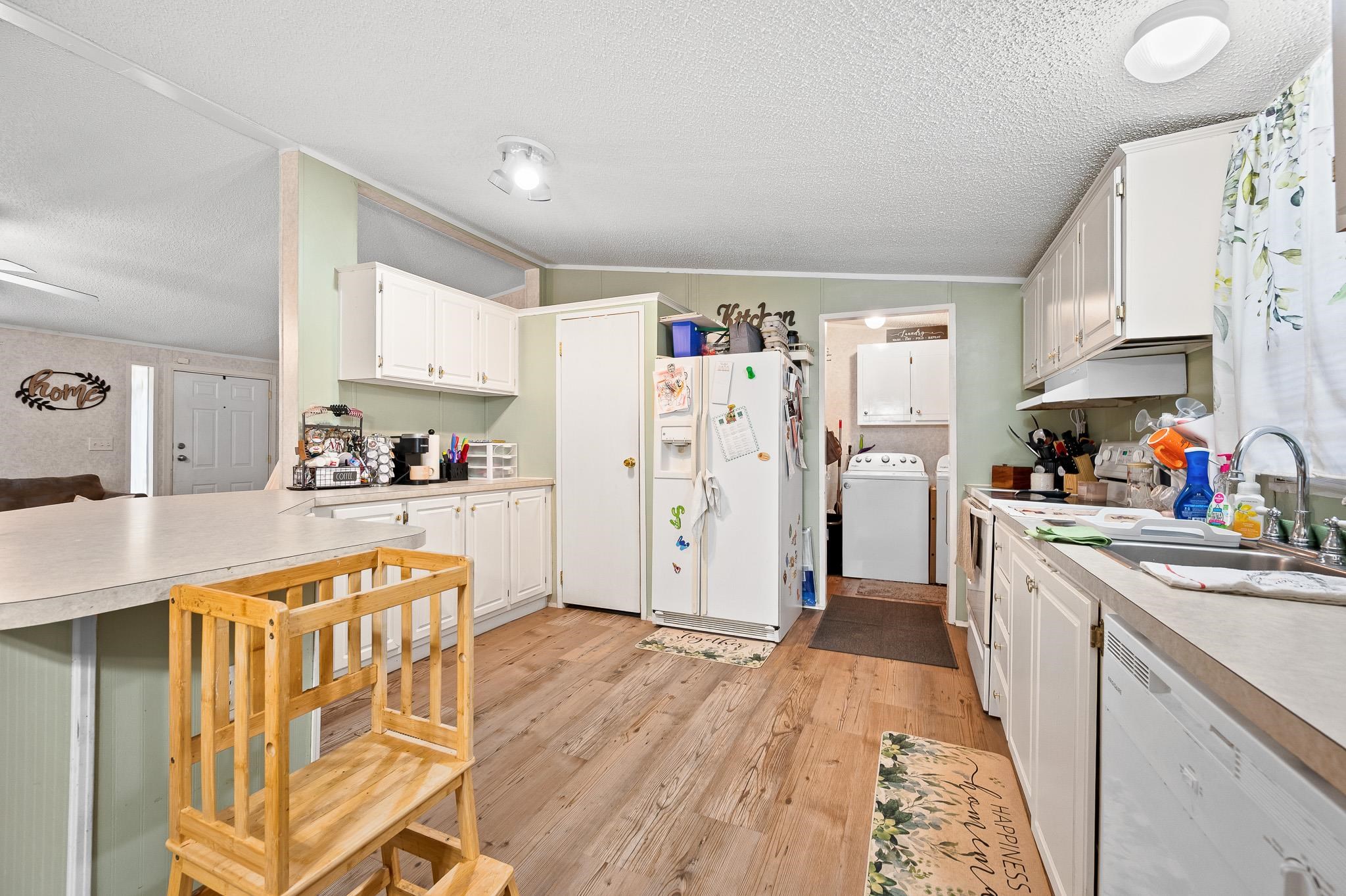 140 Garford Road Madison Heights, VA 24572 - Photo 12 of 35 a kitchen with stainless steel appliances granite countertop a refrigerator and microwave