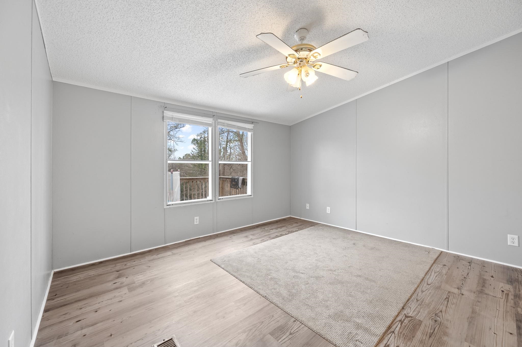 140 Garford Road Madison Heights, VA 24572 - Photo 13 of 32 wooden floor in an empty room with a window