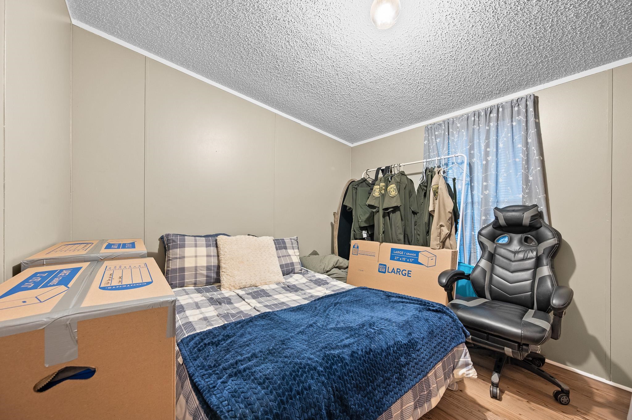 140 Garford Road Madison Heights, VA 24572 - Photo 20 of 35 a bedroom with a bed and next to a window