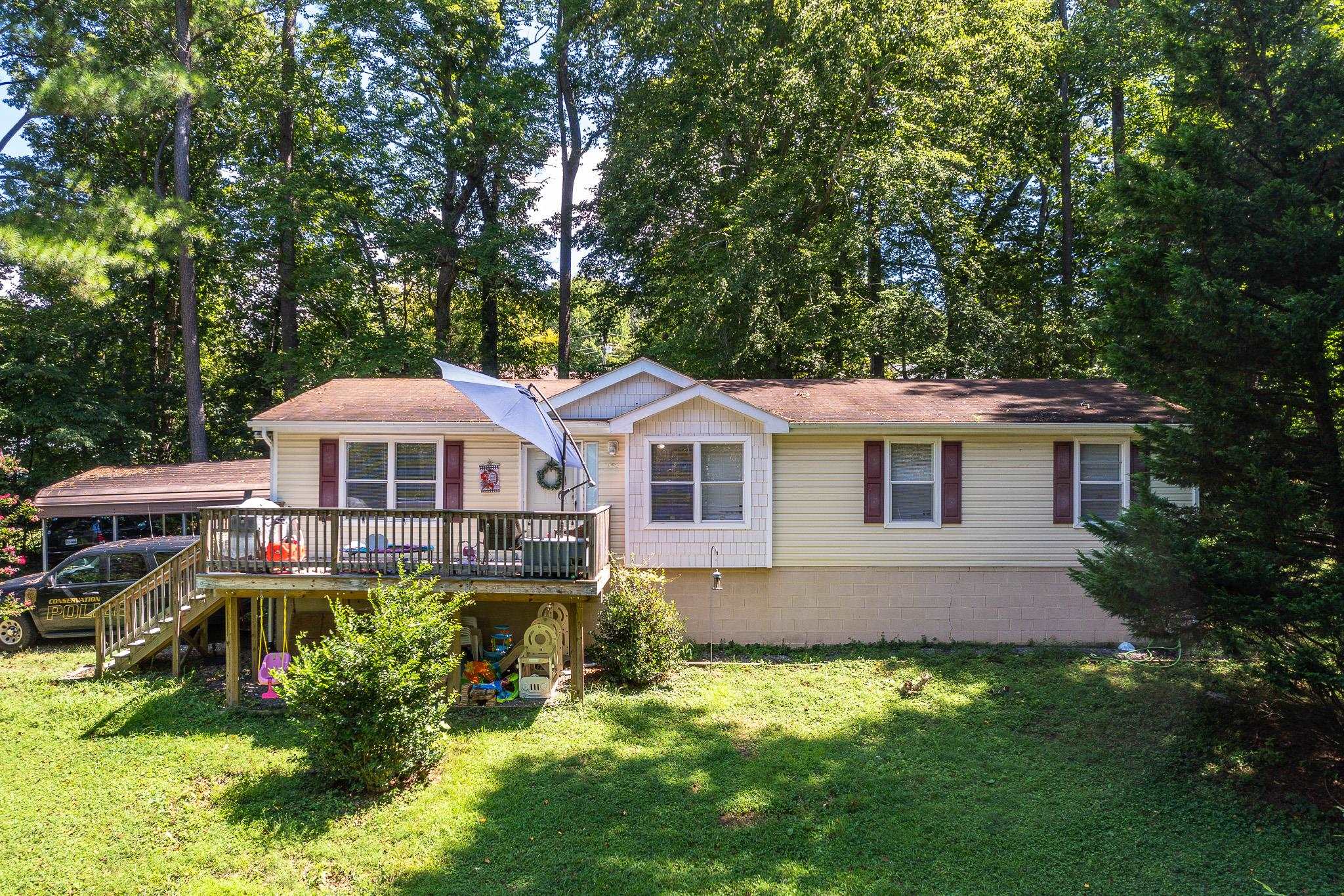140 Garford Road Madison Heights, VA 24572 - Photo 2 of 35 a front view of a house with a yard table and chairs