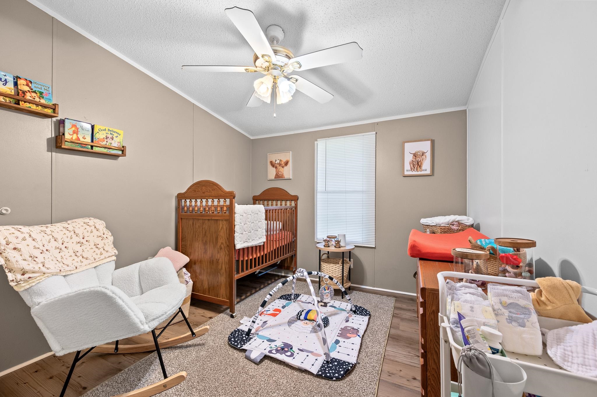 140 Garford Road Madison Heights, VA 24572 - Photo 21 of 35 a living room with furniture and a baby crib