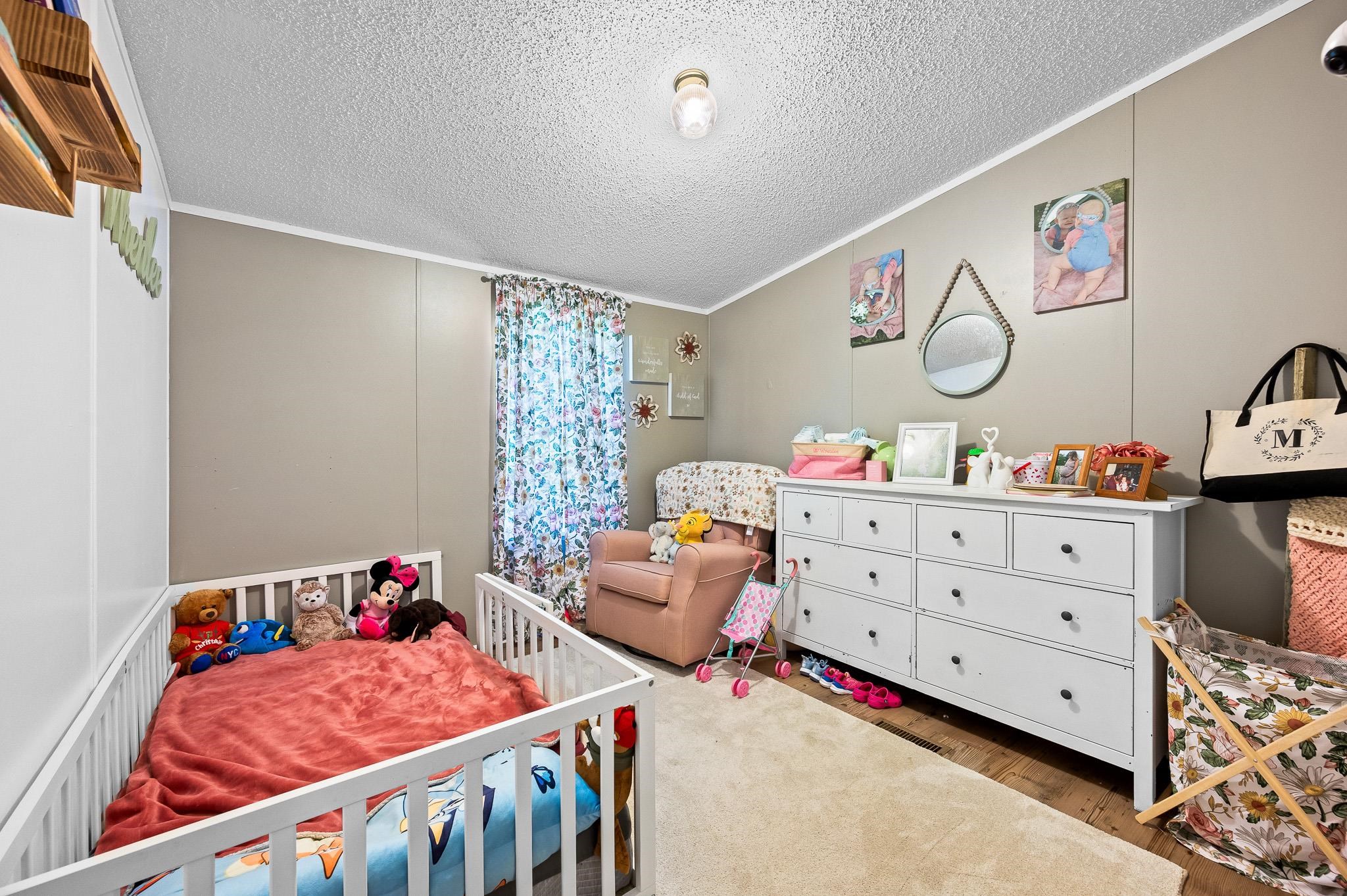 140 Garford Road Madison Heights, VA 24572 - Photo 23 of 35 a bedroom with a bed and cabinets