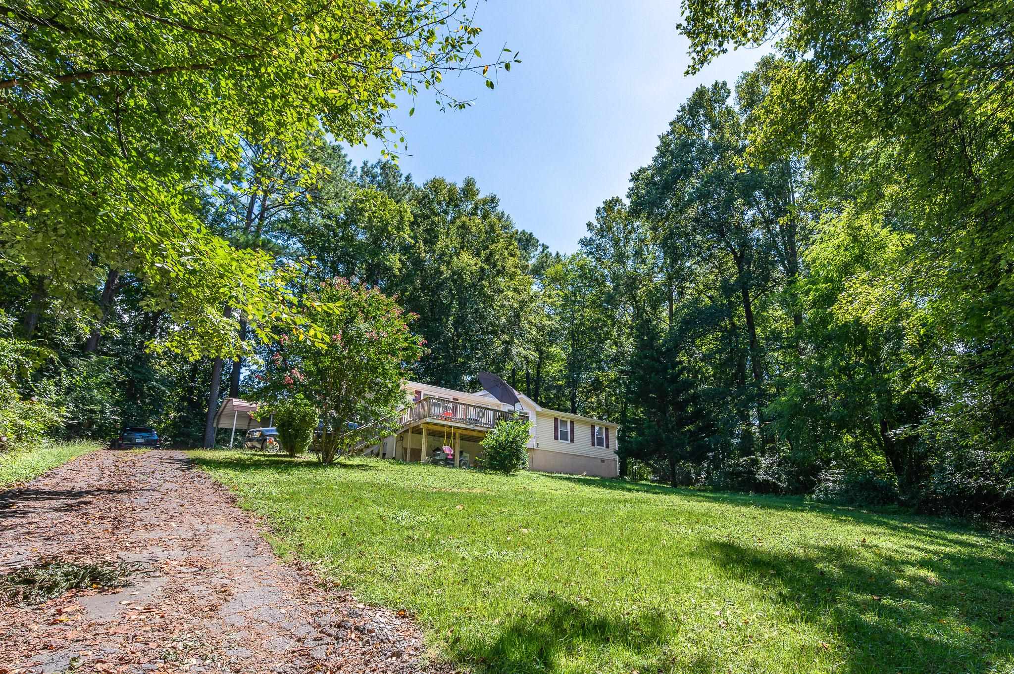 140 Garford Road Madison Heights, VA 24572 - Photo 3 of 35 a view of a trees and barn in the back yard