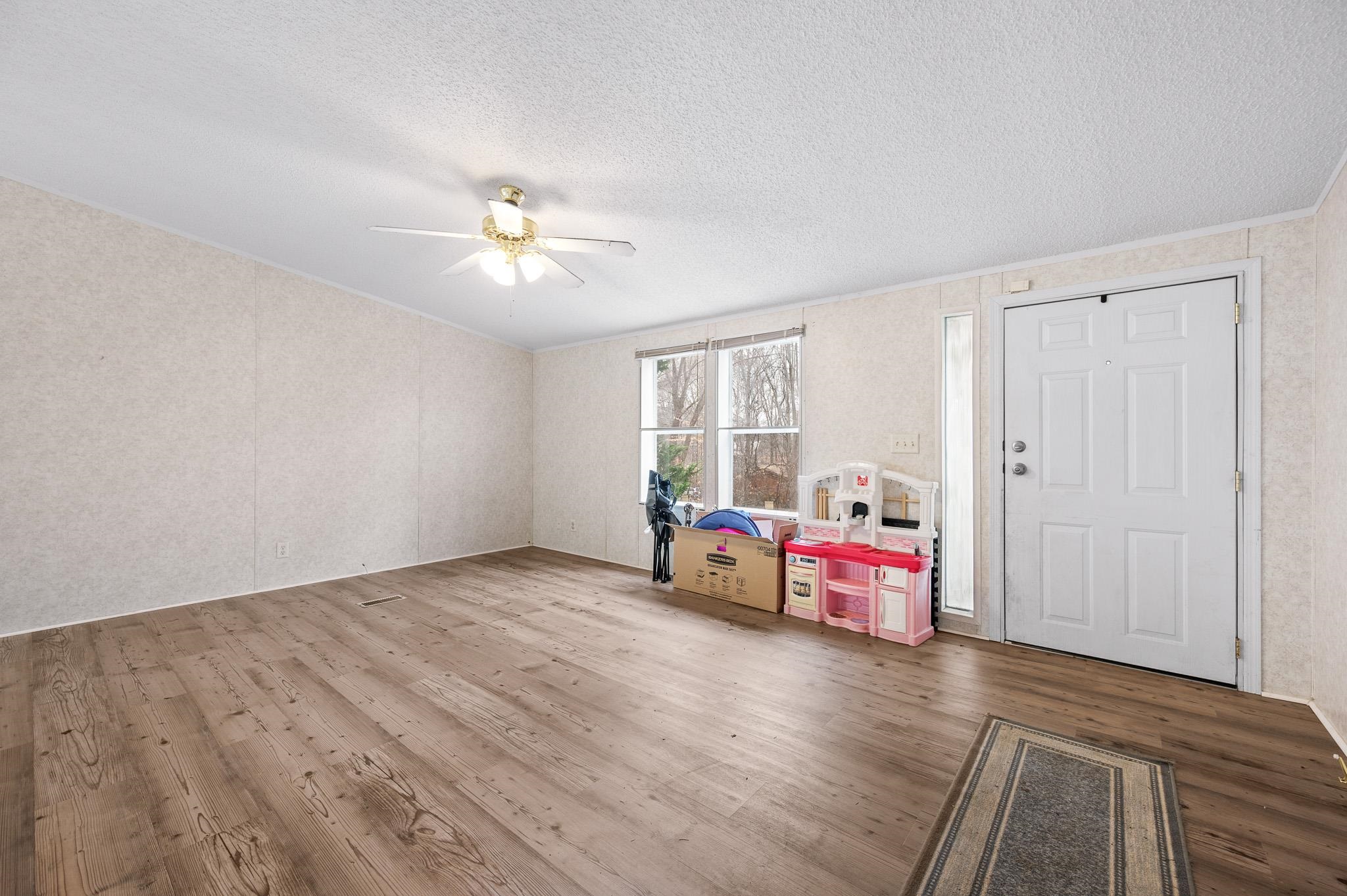 140 Garford Road Madison Heights, VA 24572 - Photo 5 of 32 a living room with hard wood floors and a window