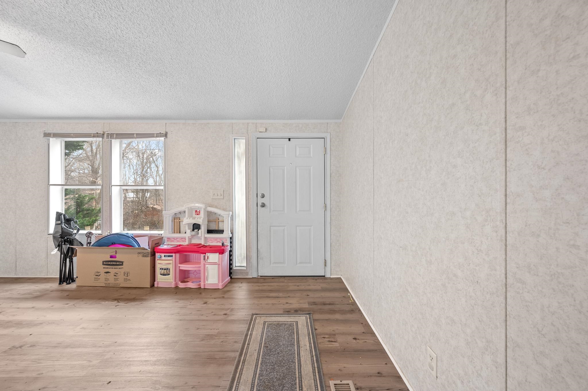 140 Garford Road Madison Heights, VA 24572 - Photo 6 of 32 a bedroom with a bed and a window