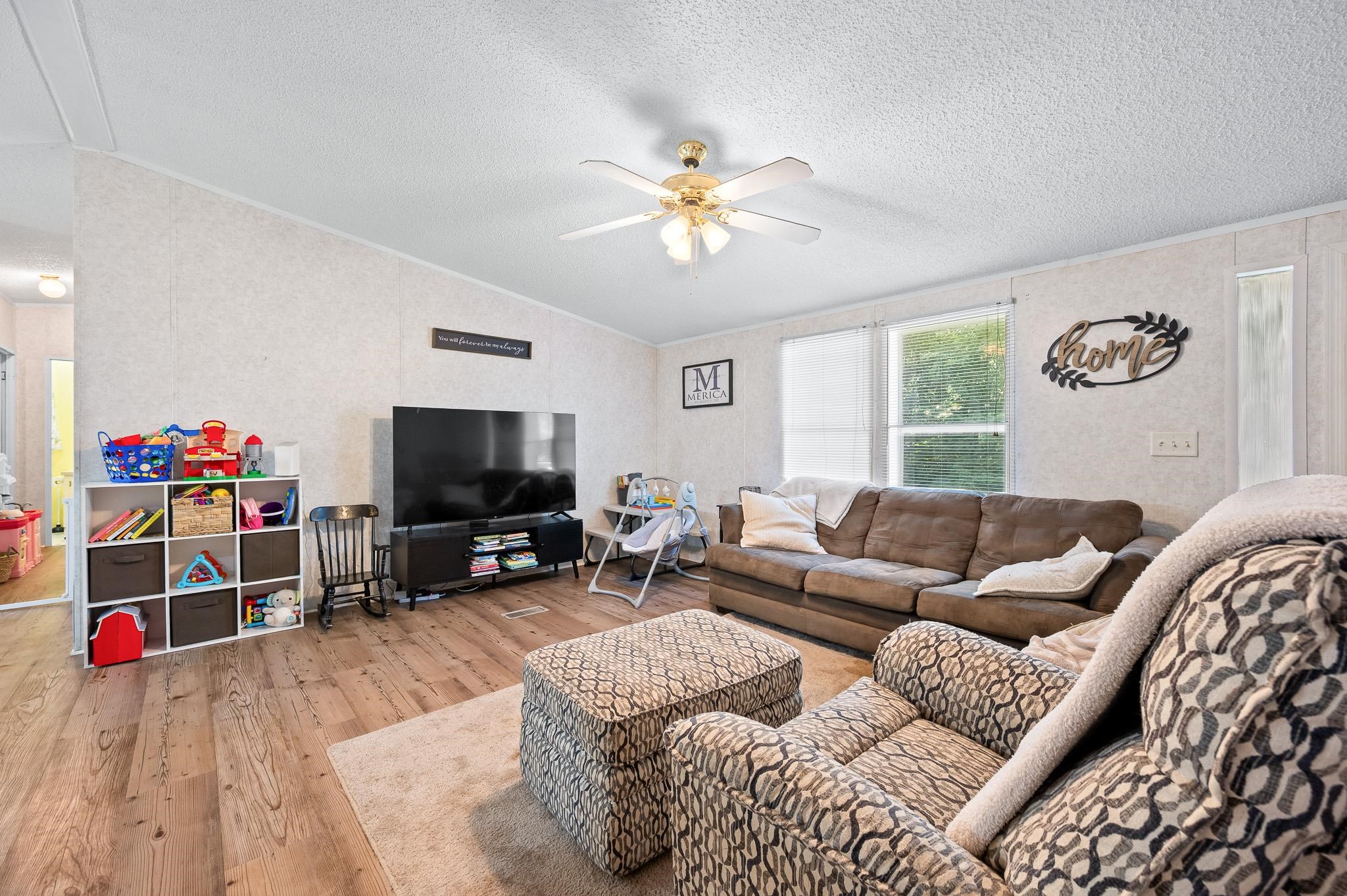 140 Garford Road Madison Heights, VA 24572 - Photo 7 of 35 a living room with furniture and a flat screen tv