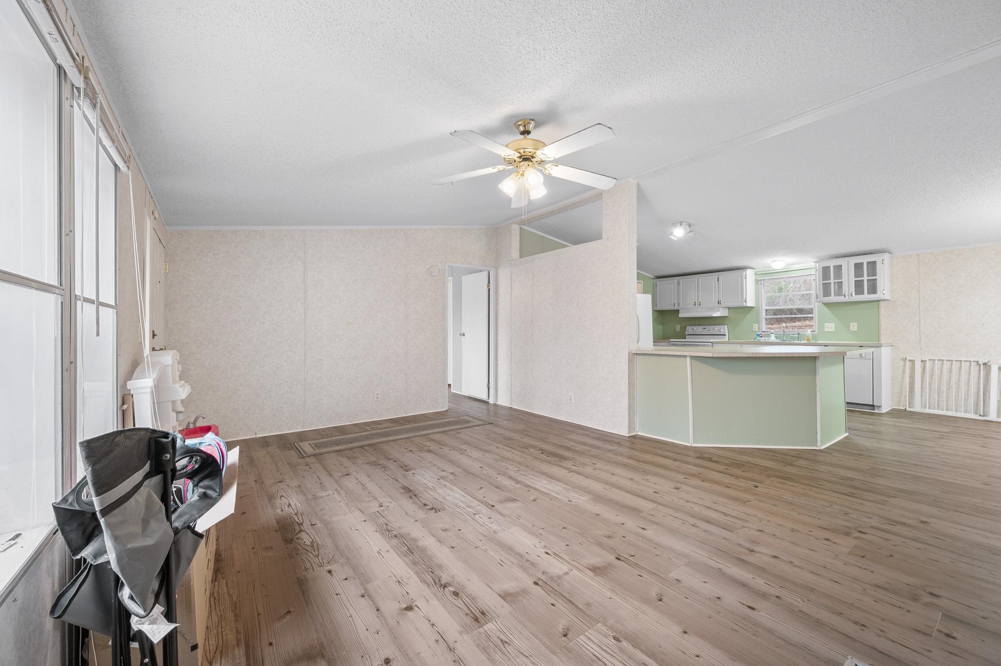 140 Garford Road Madison Heights, VA 24572 - Photo 8 of 32 a view of a kitchen with a sink dishwasher and a dishwasher with wooden floor