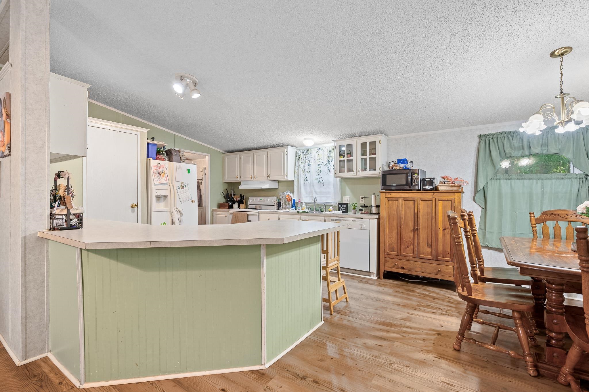 140 Garford Road Madison Heights, VA 24572 - Photo 10 of 35 a kitchen with stainless steel appliances granite countertop a sink and a refrigerator