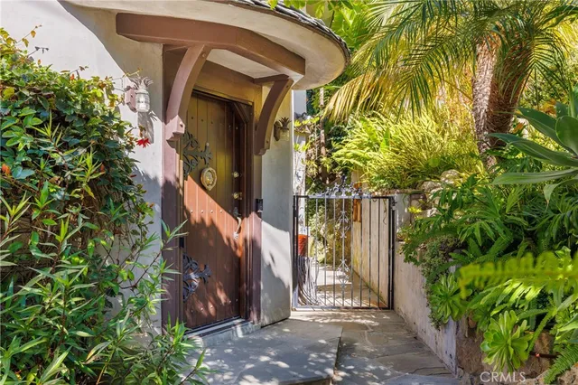 a view of a house with a tree