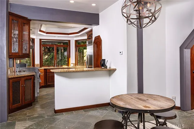 a living room with table and chairs