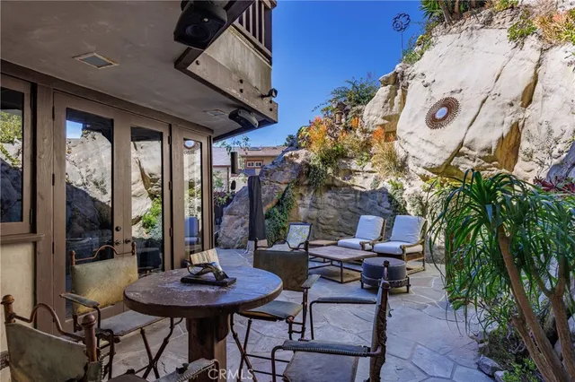 a view of a chairs and table in patio