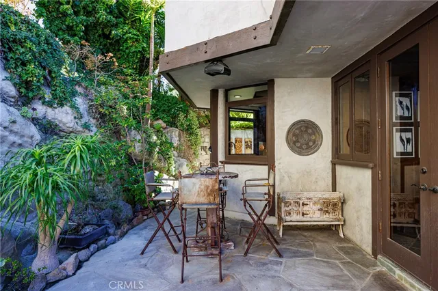 a view of a chairs and table in a patio