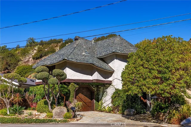 a house with trees in the background