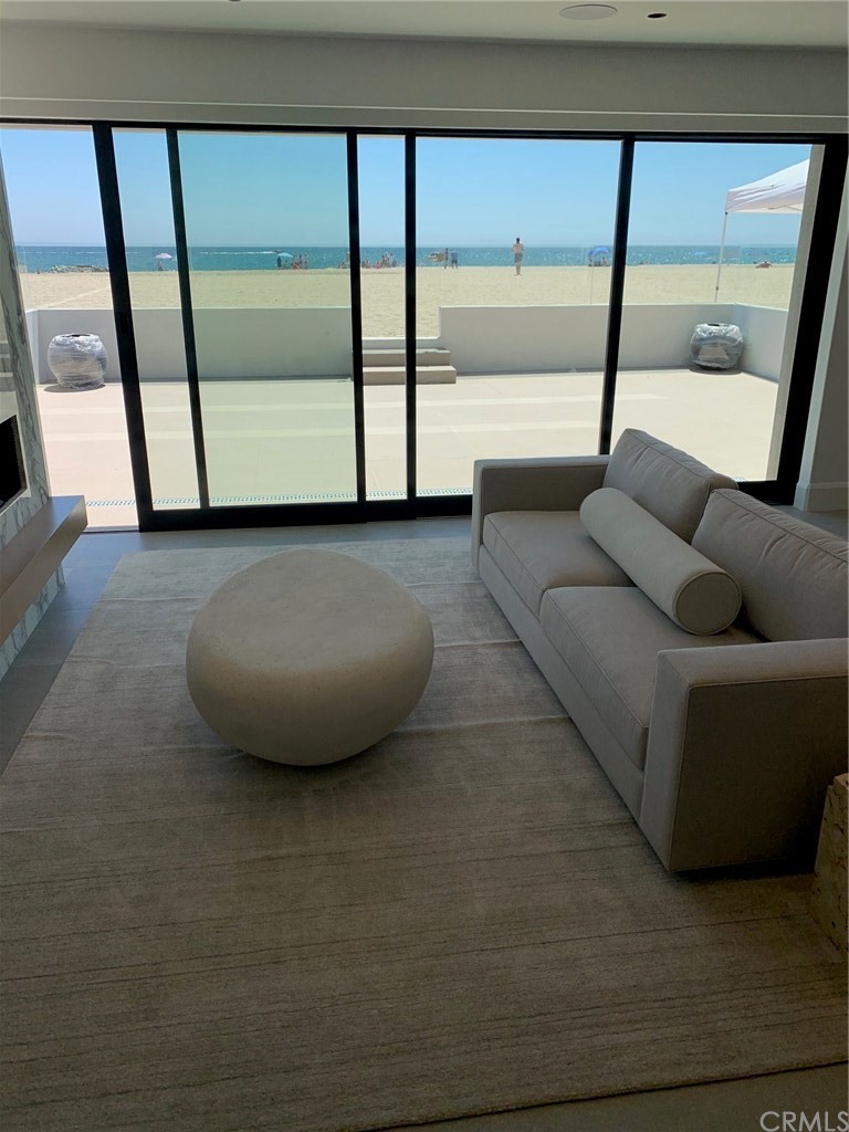 5205 Seashore Drive Newport Beach, CA 92663 - Photo 2 of 10 a living room with a large window