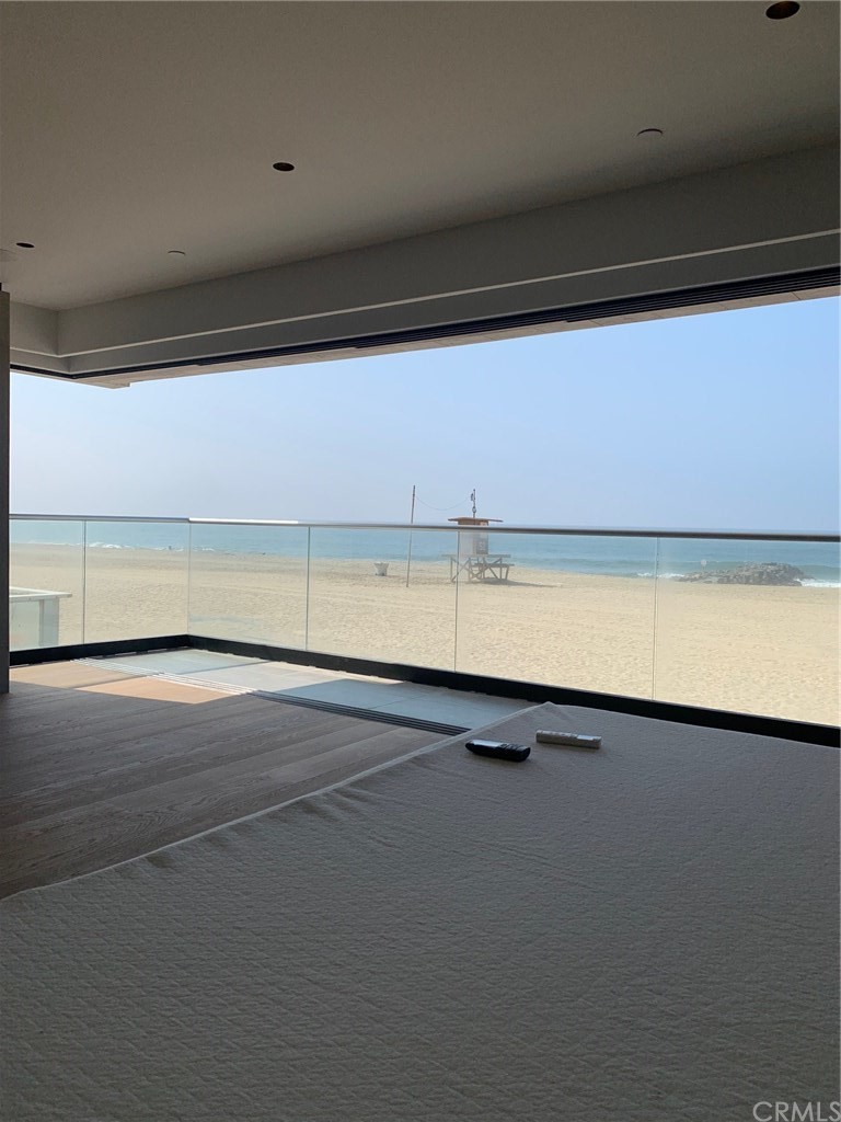 5205 Seashore Drive Newport Beach, CA 92663 - Photo 5 of 10 a view of a room with an empty space and a fireplace