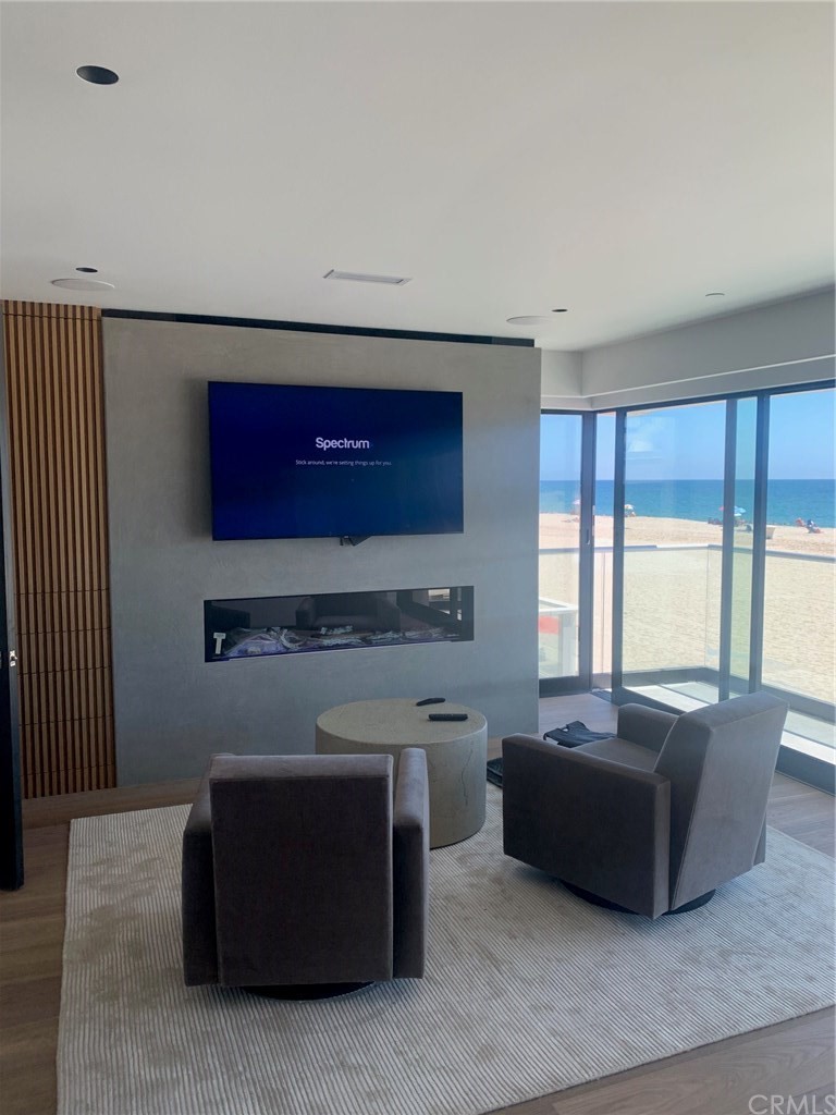 5205 Seashore Drive Newport Beach, CA 92663 - Photo 6 of 10 a living room with stainless steel appliances kitchen island granite countertop furniture and a large window