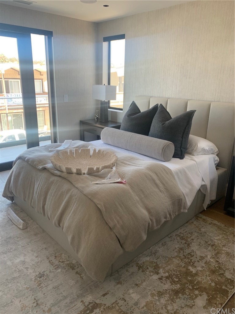 5205 Seashore Drive Newport Beach, CA 92663 - Photo 7 of 10 a bedroom with a bed and window
