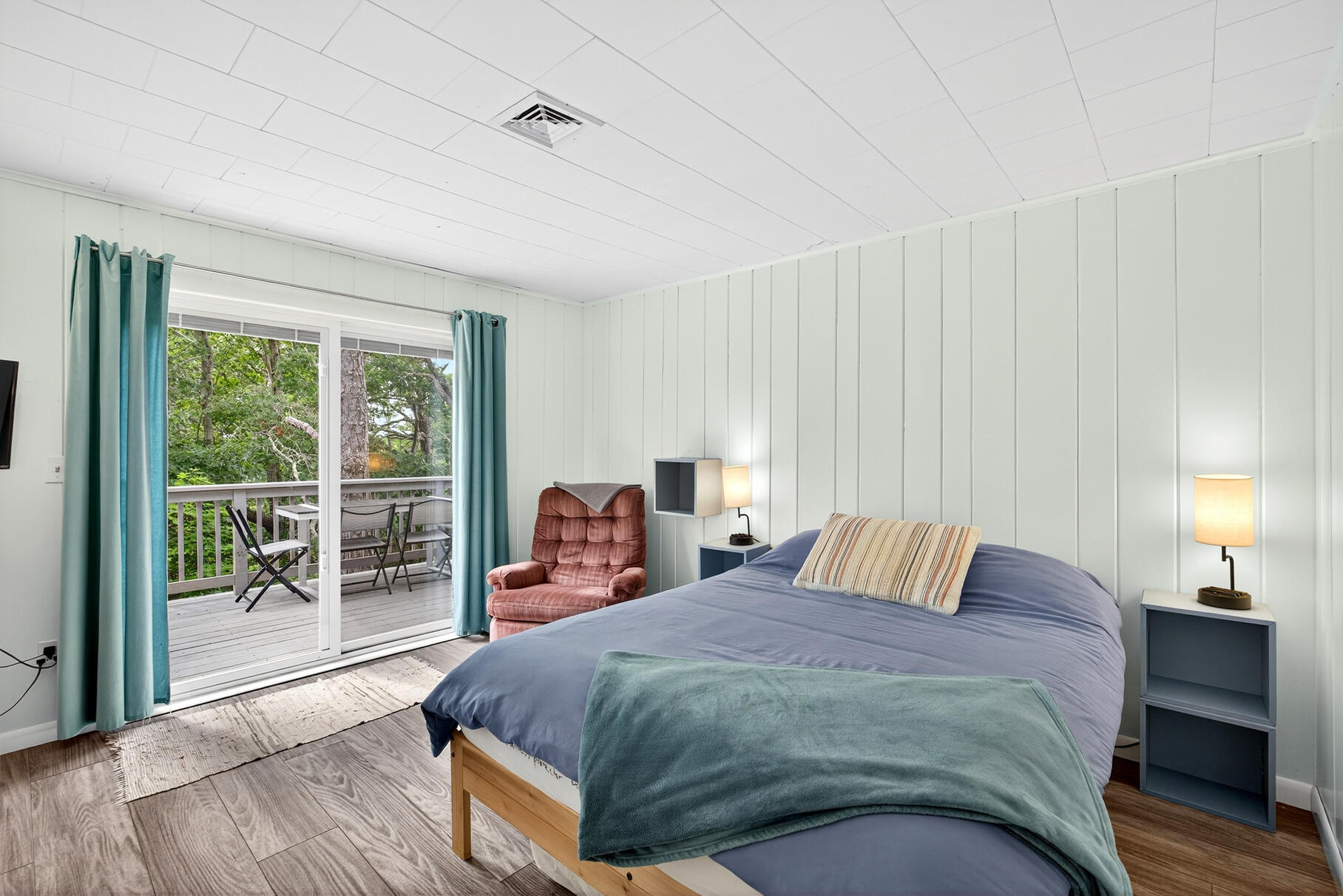 46 Hiram Hill Road Wellfleet, MA 02667 - Photo 11 of 36 a bedroom with a bed and wooden floor