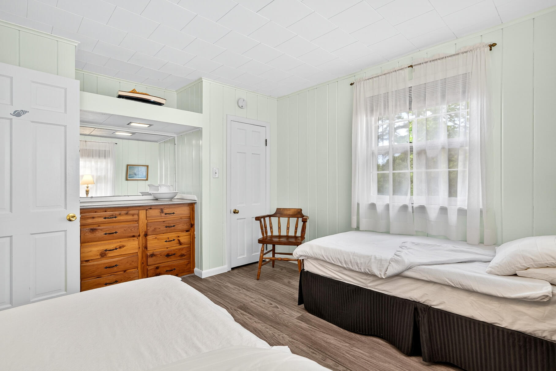 46 Hiram Hill Road Wellfleet, MA 02667 - Photo 16 of 36 a bedroom with a bed and wooden floor