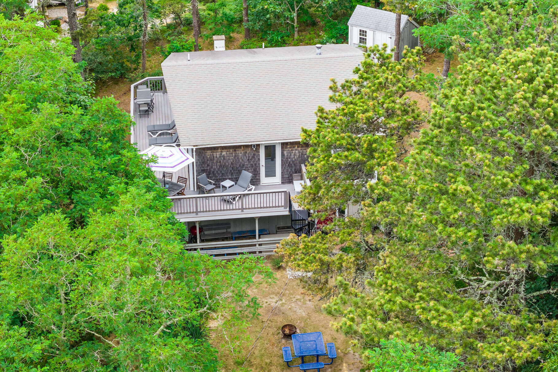 46 Hiram Hill Road Wellfleet, MA 02667 - Photo 18 of 36 an aerial view of a house with a yard and trees