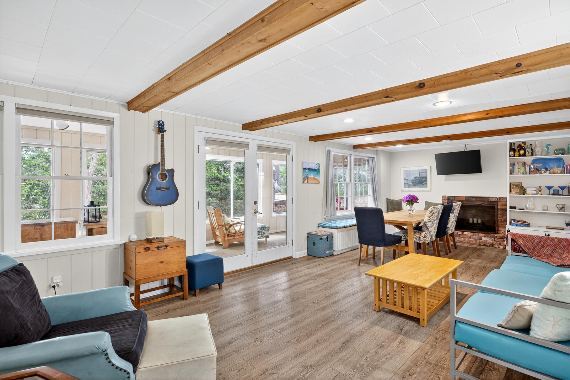 46 Hiram Hill Road Wellfleet, MA 02667 - Photo 2 of 36 a living room with furniture floor to ceiling window and a flat screen tv